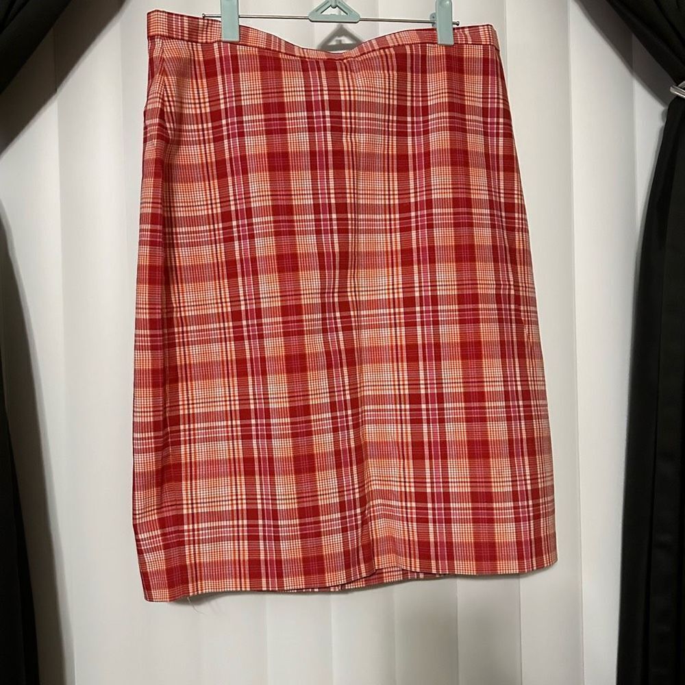 The limited stretch , plaid red/pink squares, 53% Polyester, 34% cotton, 3% span